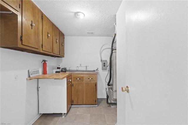 kitchen with sink and a textured ceiling