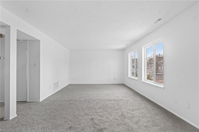 empty room with carpet flooring