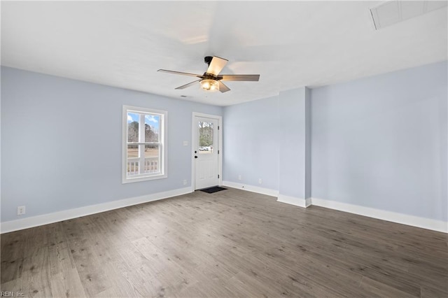 spare room with wood-type flooring and ceiling fan