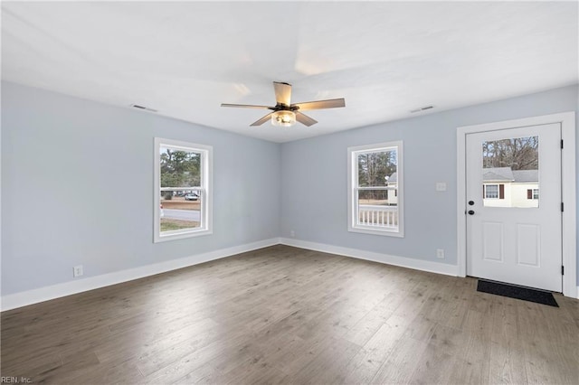 entrance foyer featuring hardwood / wood-style floors, plenty of natural light, and ceiling fan