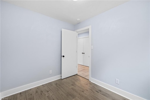 spare room featuring light hardwood / wood-style floors