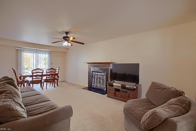 living room featuring light colored carpet and ceiling fan