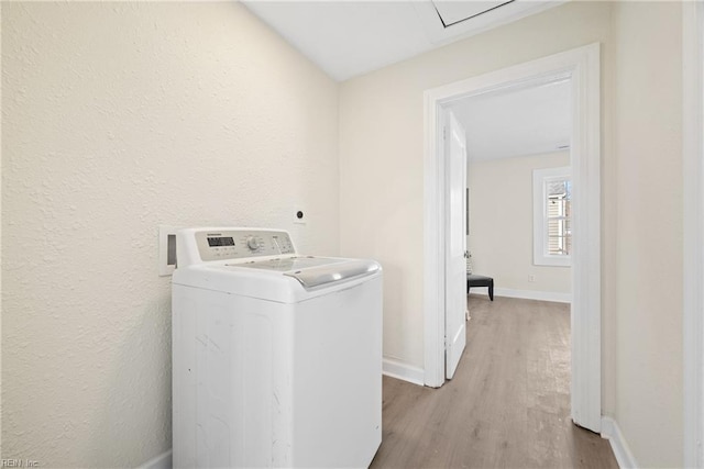 washroom featuring washer / dryer and light wood-type flooring