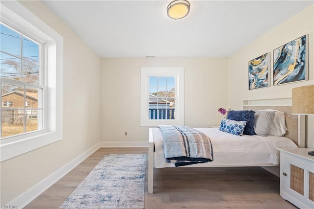 bedroom with light hardwood / wood-style floors