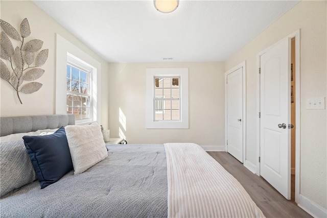 bedroom with hardwood / wood-style flooring