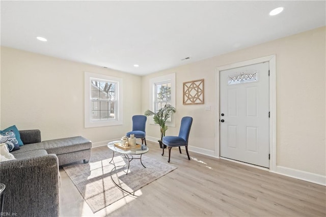 living room with light hardwood / wood-style flooring