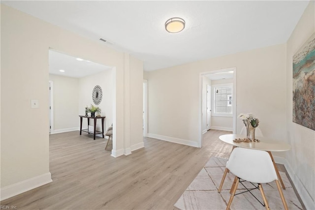 corridor featuring light hardwood / wood-style floors