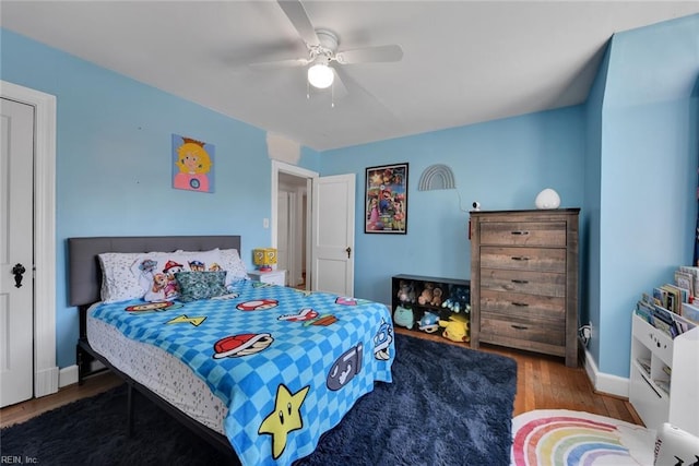 bedroom with hardwood / wood-style flooring and ceiling fan