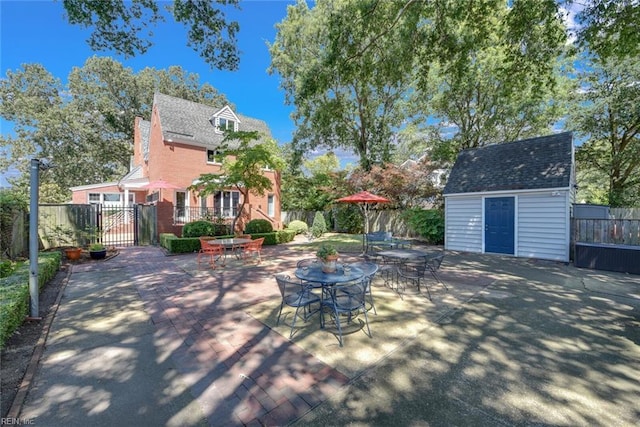 view of patio / terrace featuring a storage shed