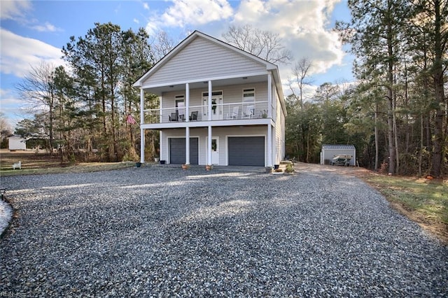 view of front of property with a garage and a balcony