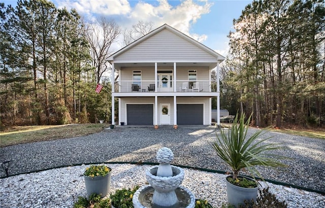 view of front facade featuring a balcony and a garage