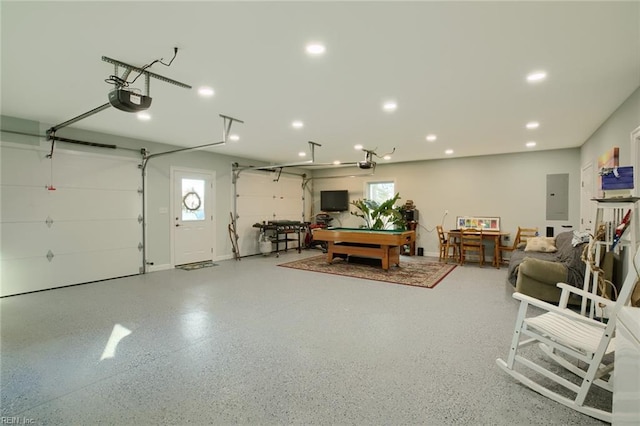 garage featuring a garage door opener and electric panel