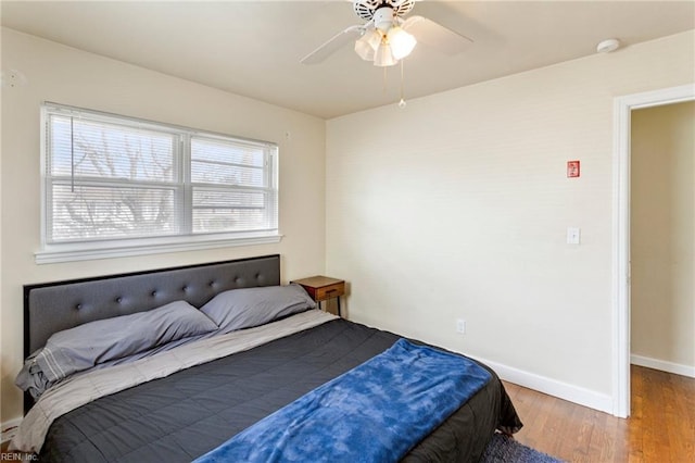 bedroom featuring ceiling fan and hardwood / wood-style floors