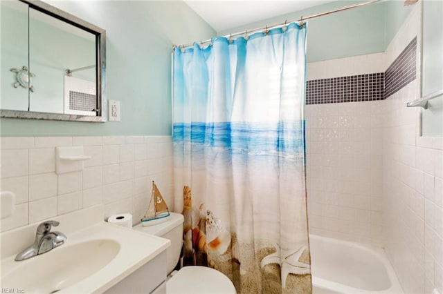 full bathroom featuring vanity, tile walls, shower / tub combo, and toilet