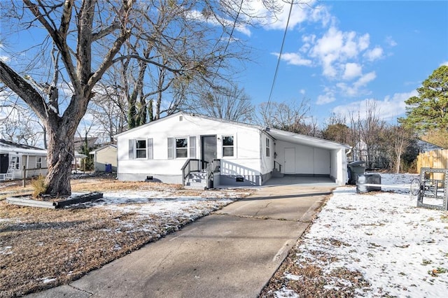 view of front of home featuring a carport