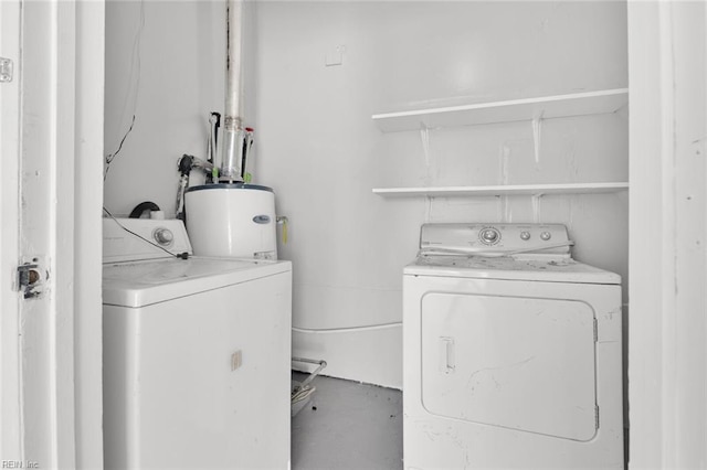 laundry area featuring water heater and washer and dryer