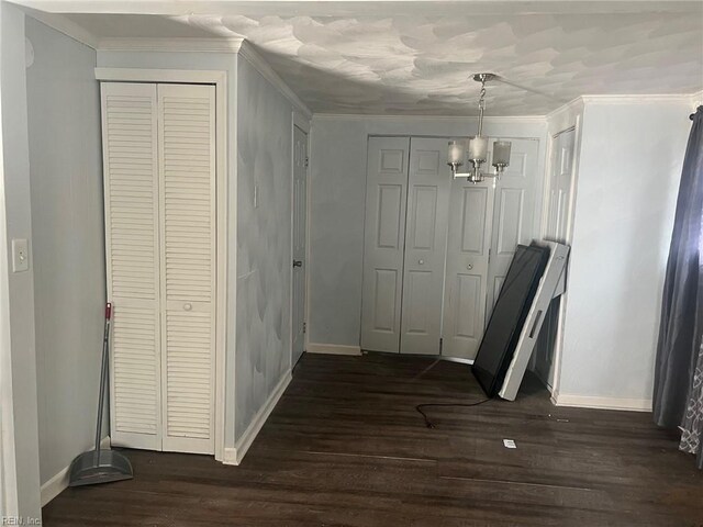 6336 Old Townpoint Rd, Suffolk, VA 23435 - hallway with ornamental molding, dark hardwood / wood-style floors, and a chandelier