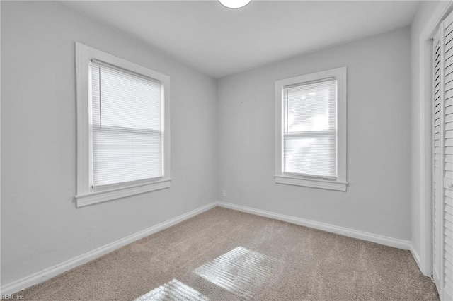 spare room with light carpet