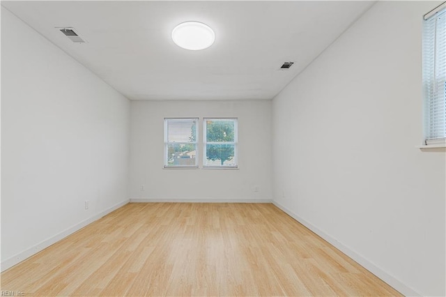 unfurnished room featuring light hardwood / wood-style floors