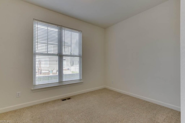 empty room featuring carpet flooring