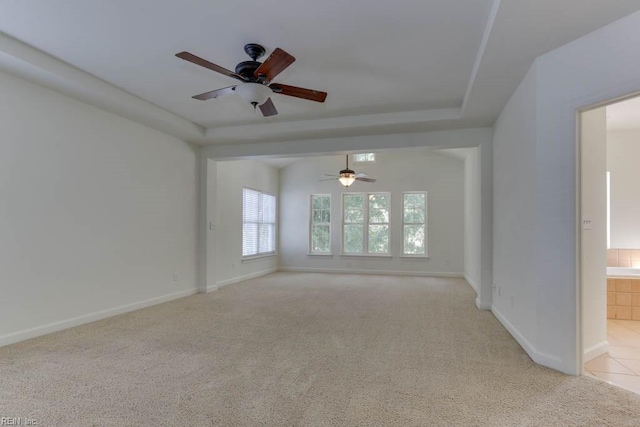 carpeted empty room with ceiling fan