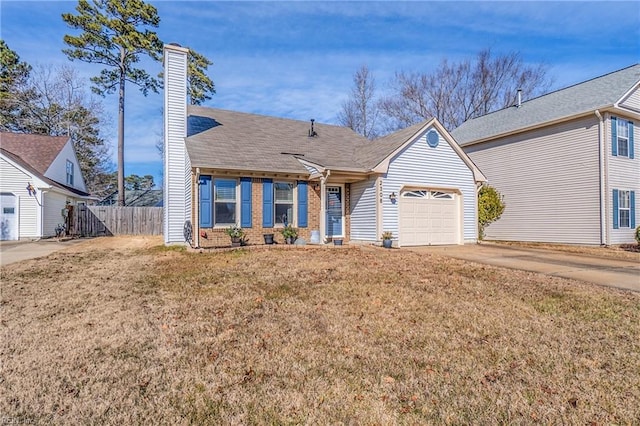 view of front of house featuring a garage and a front yard