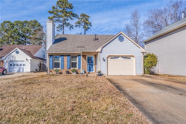 view of front of house featuring a garage and a front lawn