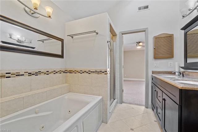 bathroom featuring tile patterned flooring, vanity, shower with separate bathtub, and ceiling fan