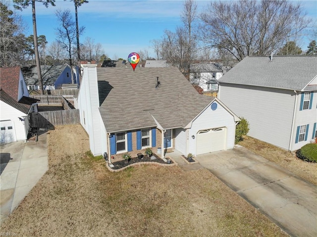 view of front of house with a garage and a front lawn