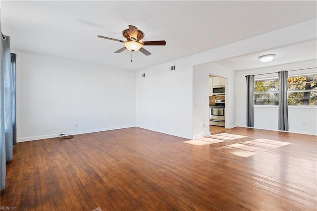 empty room with ceiling fan and light hardwood / wood-style floors