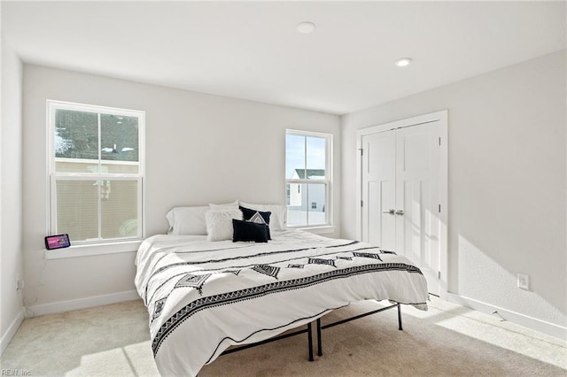 carpeted bedroom featuring a closet