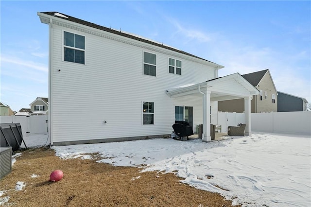 view of snow covered property