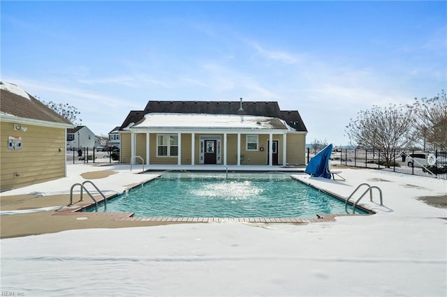 snow covered pool featuring a patio