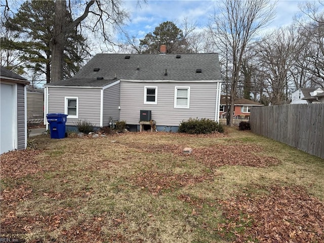 rear view of house with a lawn