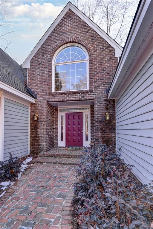 view of exterior entry with a garage