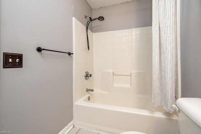 bathroom featuring toilet, shower / bathtub combination with curtain, and tile patterned flooring