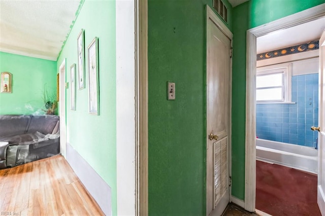 corridor featuring hardwood / wood-style floors