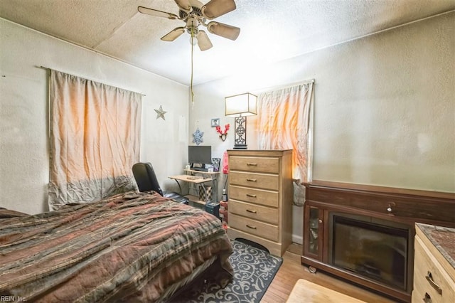 bedroom featuring ceiling fan and light hardwood / wood-style floors