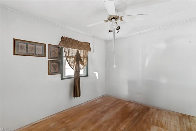 spare room with ceiling fan and hardwood / wood-style floors