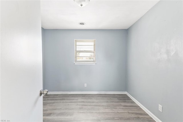 empty room with light wood-type flooring