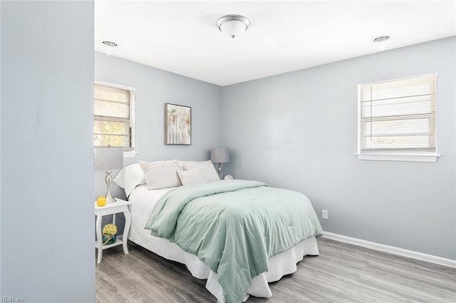 bedroom with hardwood / wood-style flooring