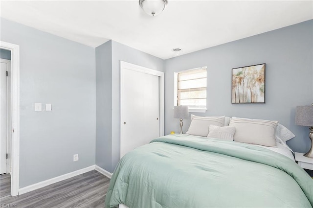 bedroom featuring hardwood / wood-style flooring and a closet