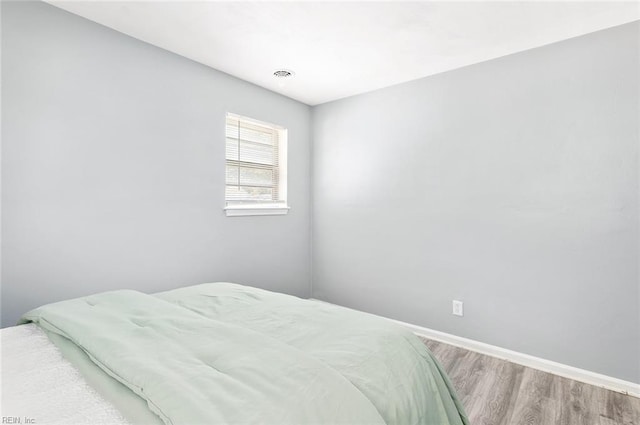 bedroom featuring hardwood / wood-style floors