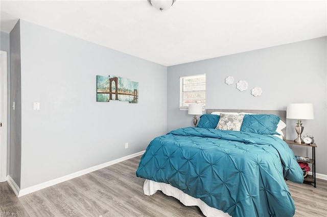 bedroom featuring wood-type flooring