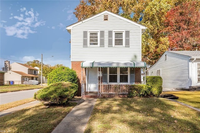 view of property featuring a front yard