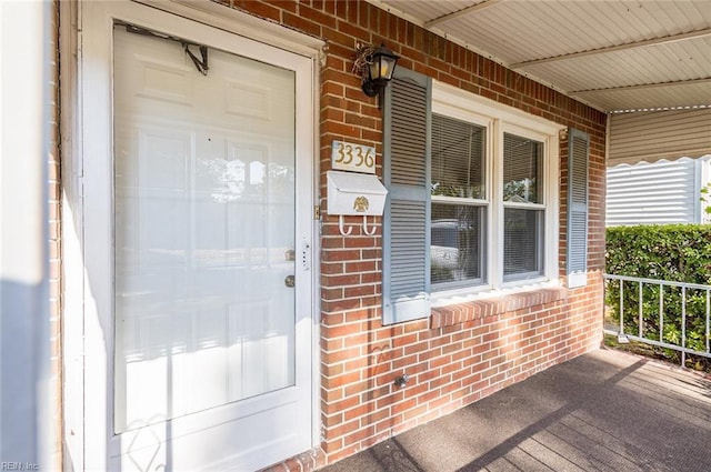 doorway to property featuring a porch