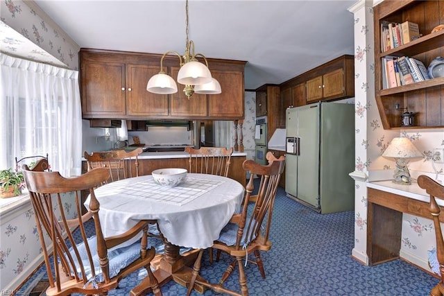 dining space featuring baseboards and wallpapered walls