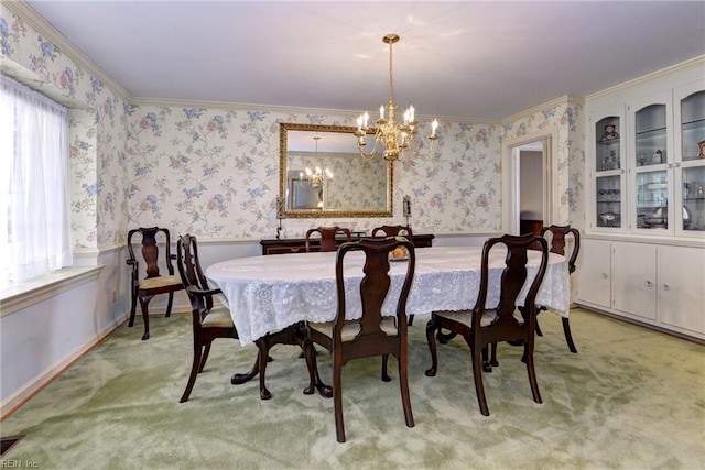 dining room featuring wallpapered walls, wainscoting, light colored carpet, ornamental molding, and a notable chandelier