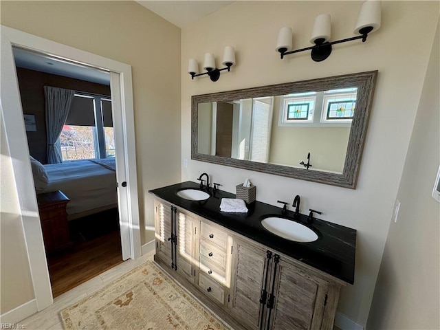 bathroom featuring vanity, hardwood / wood-style flooring, and plenty of natural light