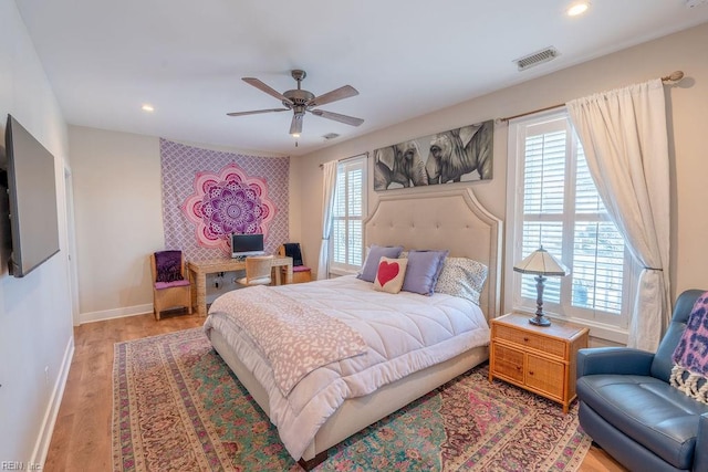 bedroom featuring light hardwood / wood-style flooring and ceiling fan